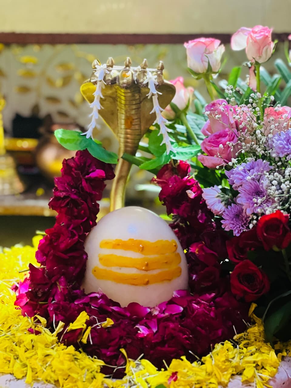 Shree Nilkanth Mahadev temple at Bapupura — Nandi statue and flower-decorated courtyard at dusk